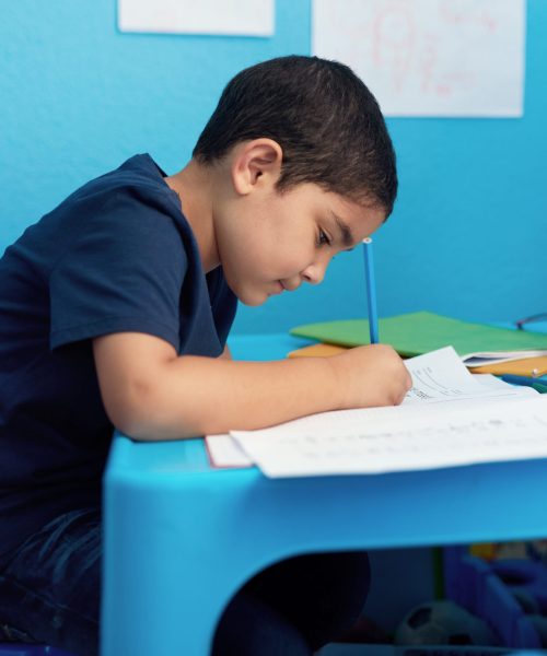 Writing, notebooks and child with homework in house for education, learning or development with knowledge. Scholarship, kid and boy student studying mathematics for school assignment in apartment.